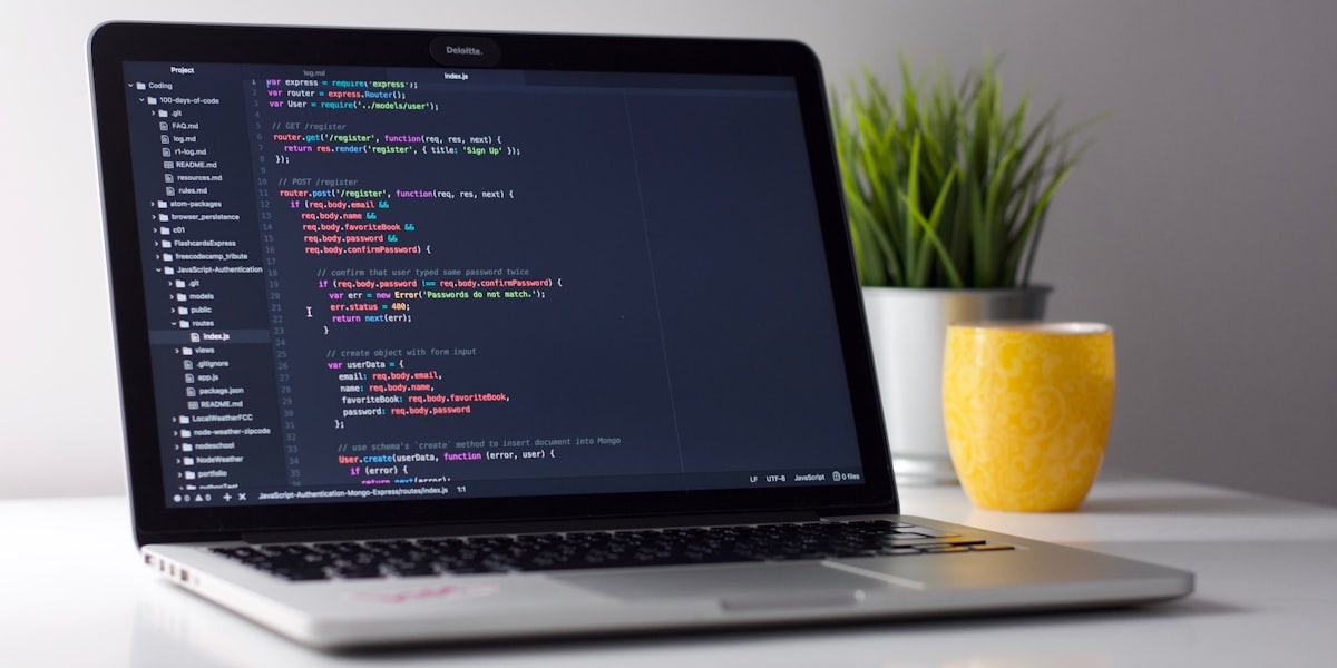 Laptop with code on screen representing AI model training and software workflows